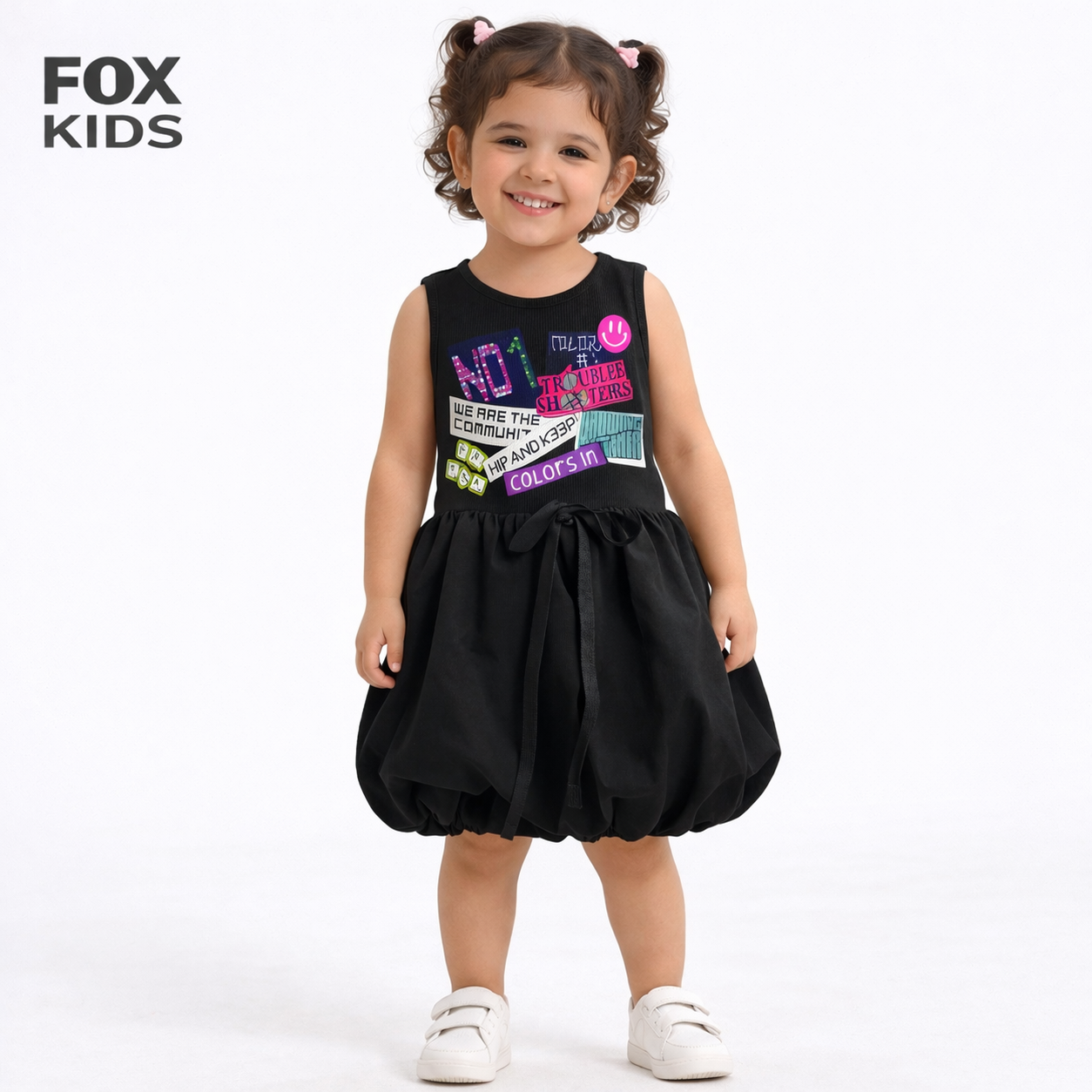 Pink girls' dress from Fox Kids featuring a floral pattern and ruffled sleeves, suitable for casual or special occasions.