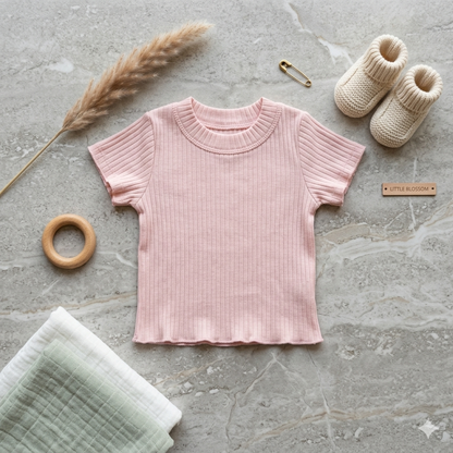 Pink girls' top by Fox Kids, featuring a comfortable fit and soft fabric, shown on a hanger.