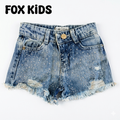 Kids' denim shorts by Fox Kids featuring a stylish design, perfect for girls, shown on a girl wearing casual summer clothing.