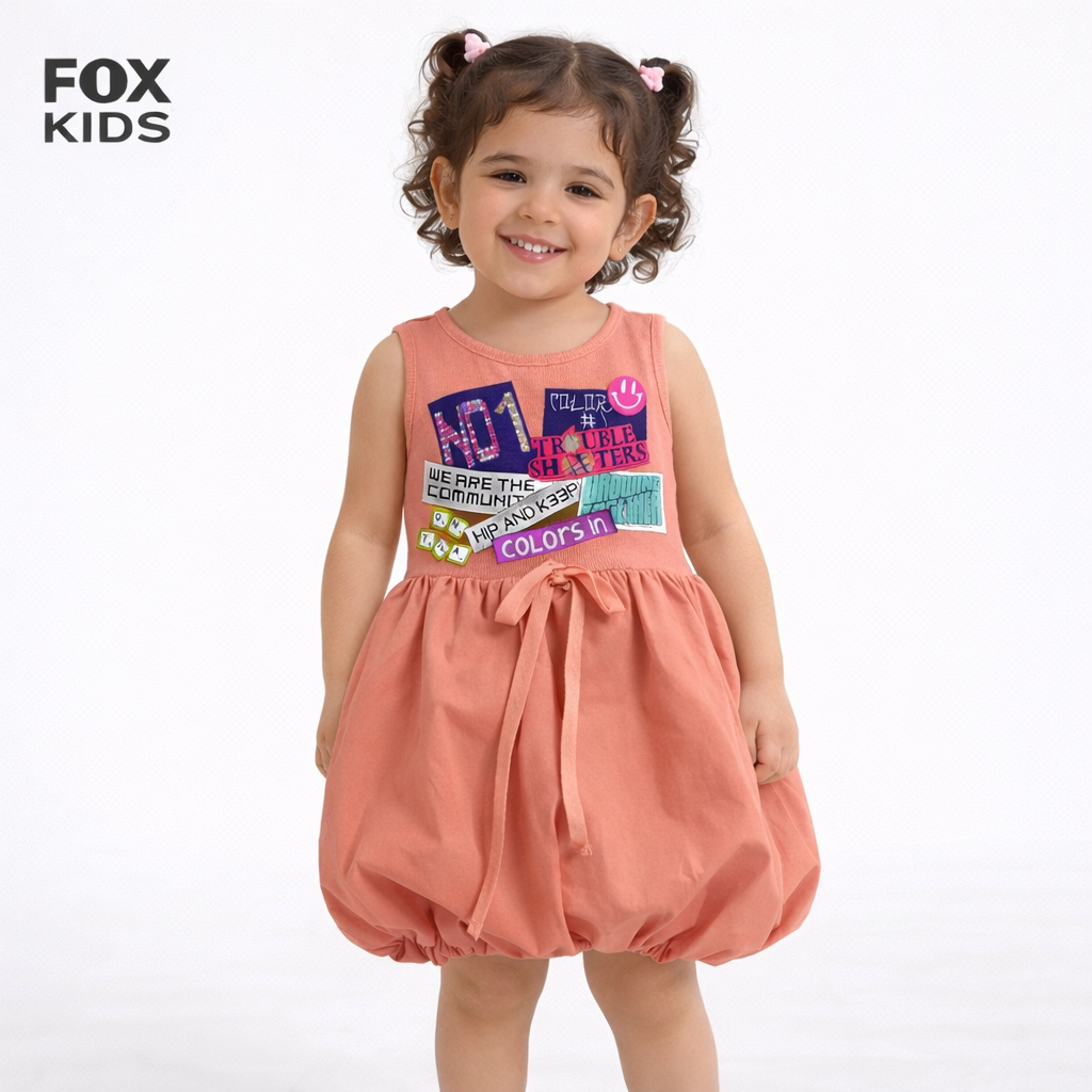 Pink girls' dress from Fox Kids featuring ruffled sleeves and floral pattern, perfect for casual or special occasions.