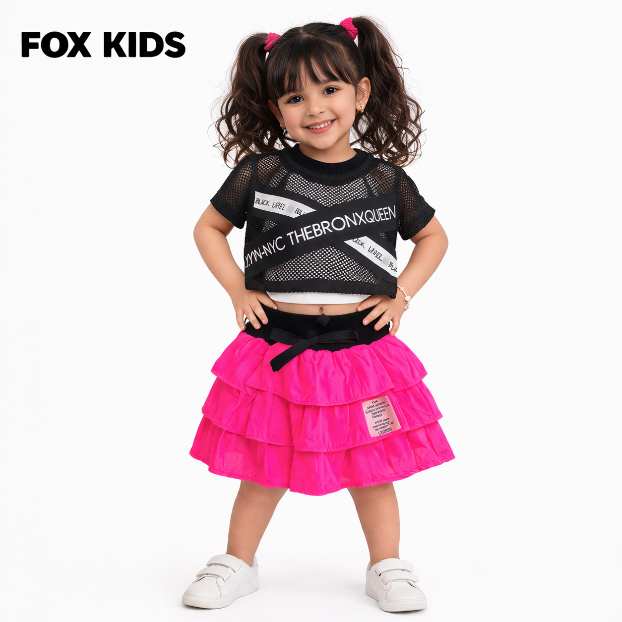 Pink girls' cotton romper with front pocket and short sleeves, by Fox Kids, displayed on a neutral background.
